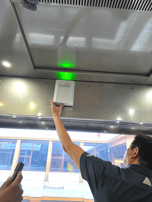PurAire LiftPro-1 bipolar ioniser being installed in a lift car ceiling at a Singapore university campus